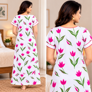 Yoga women's cotton floral printed nighty with front zip, white fabric with orange and green leaf patterns and contrast orange neckline.